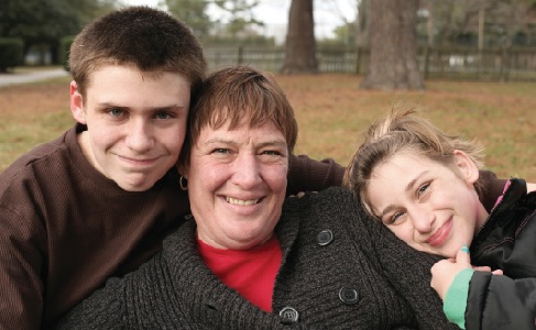 Image of woman and two children.